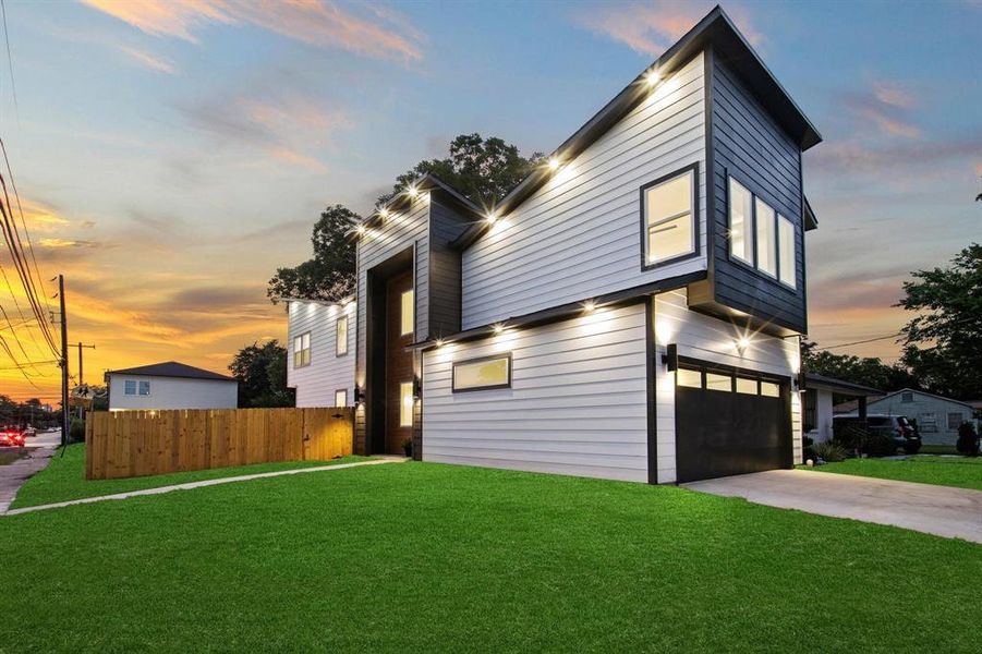 Contemporary house featuring driveway and a garage