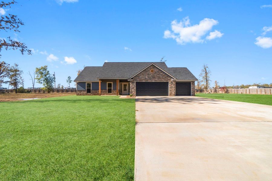 Front exterior of a new home in , Onalaska, TX, highlighting curb appeal (Image 19).