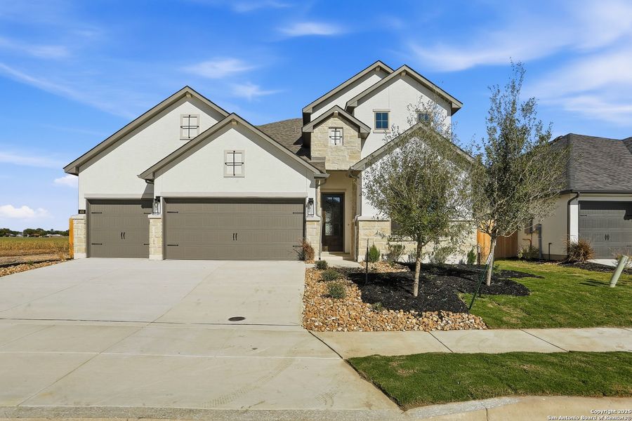 Front exterior of a new home in Legacy at Lake Dunlap, New Braunfels, TX, highlighting curb appeal (Image 29). Front exterior of a new home in Legacy at Lake Dunlap, New Braunfels, TX, highlighting curb appeal (Image 29).