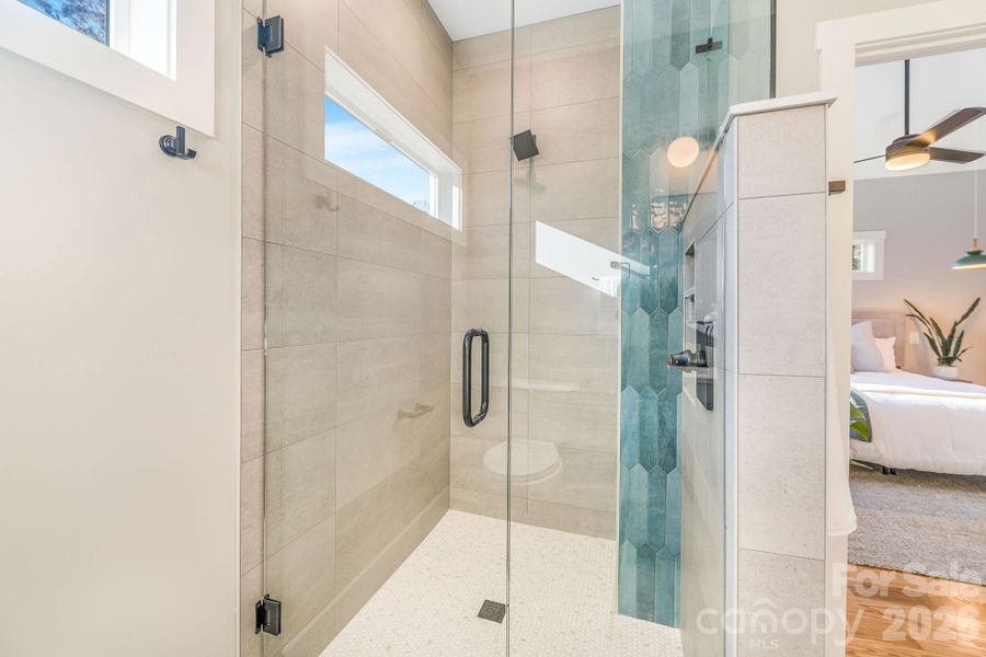 Full glass shower and rain head in primary bath