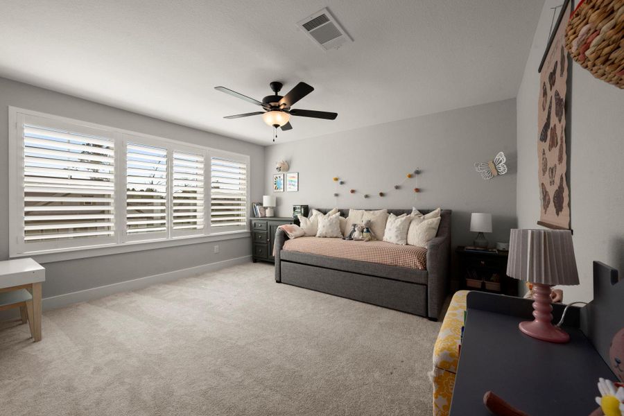 Large windows fill this bedroom with light - making it a fun and inviting space Large windows fill this bedroom with light - making it a fun and inviting space