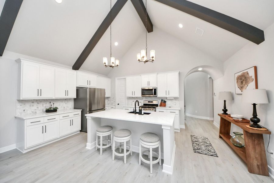Modern kitchen with beam accents.