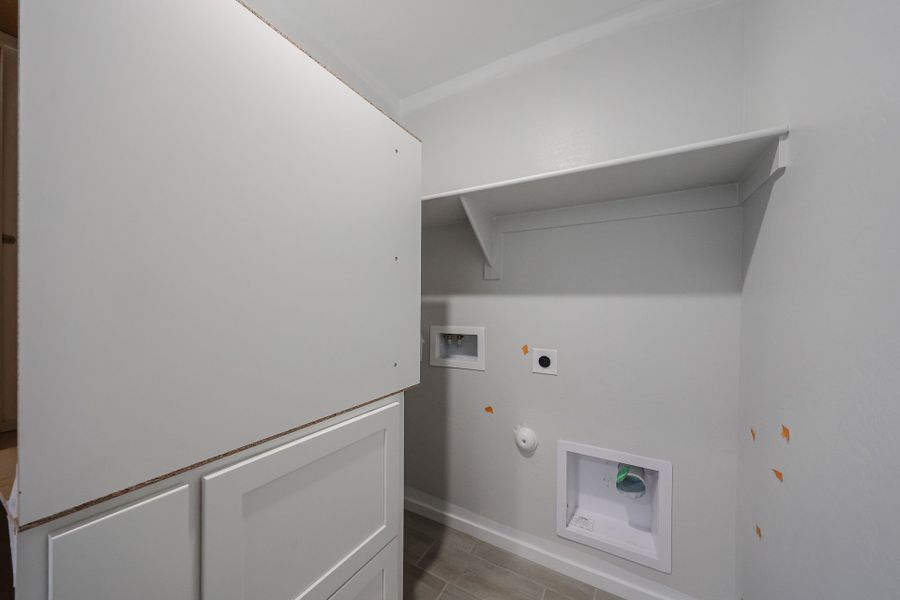 A white wall with a vent and a white door. A white wall with a vent and a white door.