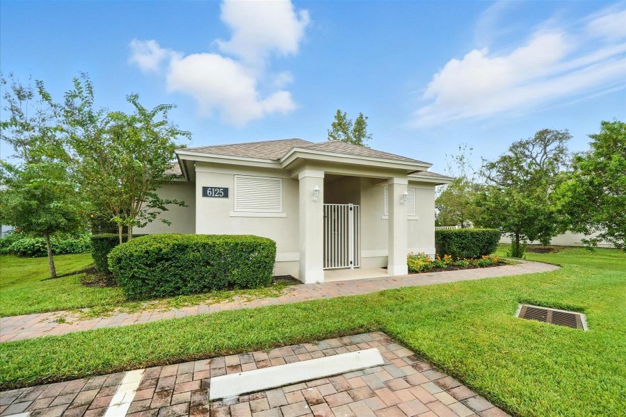 Front exterior of a new home in Bella Rosa, Vero Beach, FL, highlighting curb appeal (Image 1). Front exterior of a new home in Bella Rosa, Vero Beach, FL, highlighting curb appeal (Image 1).
