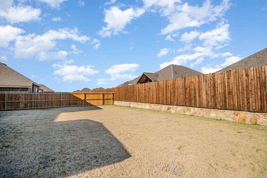 Exterior details and patio area of a home in Mustang Place II, Heartland (Image 20).