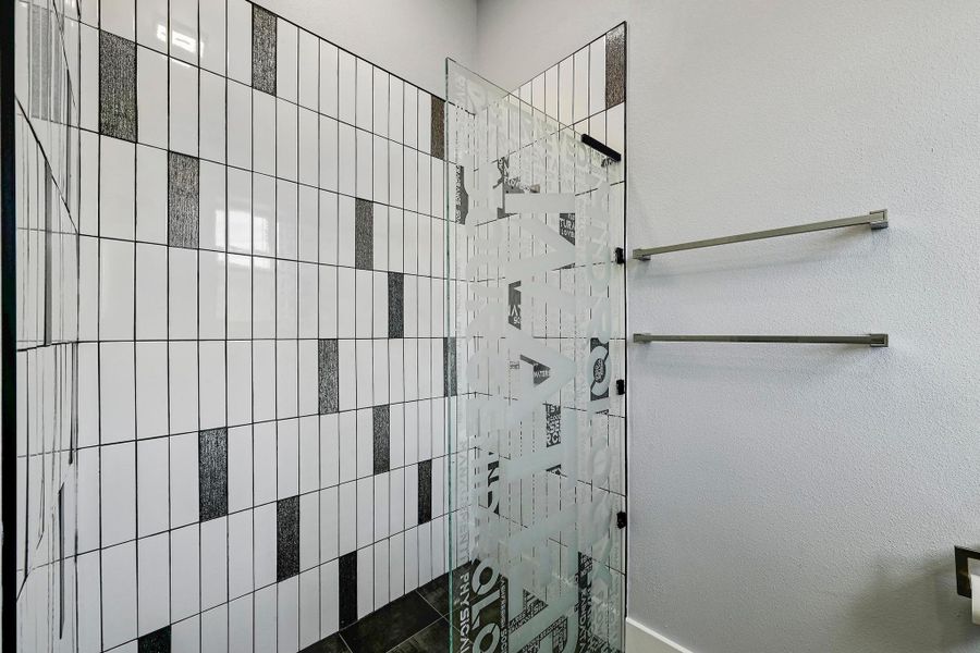 The guest ensuite walk-in shower also comes with custom frameless glass to inspire your guests. The guest ensuite walk-in shower also comes with custom frameless glass to inspire your guests.
