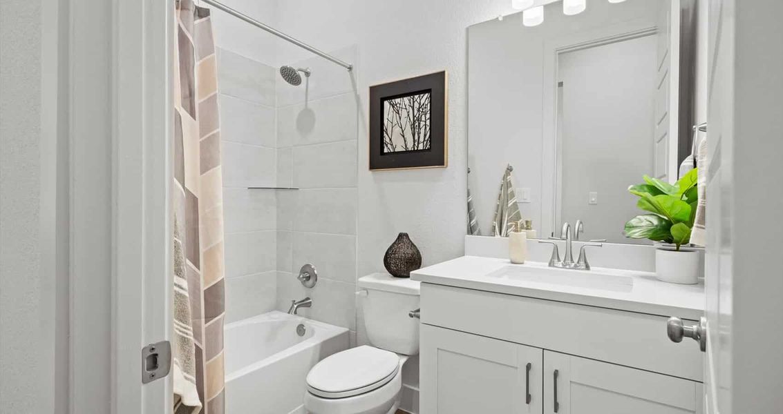 Representative furnished interior of a home built from the Wyatt by Chesmar Homes in Sunfield, Buda (Image 9).