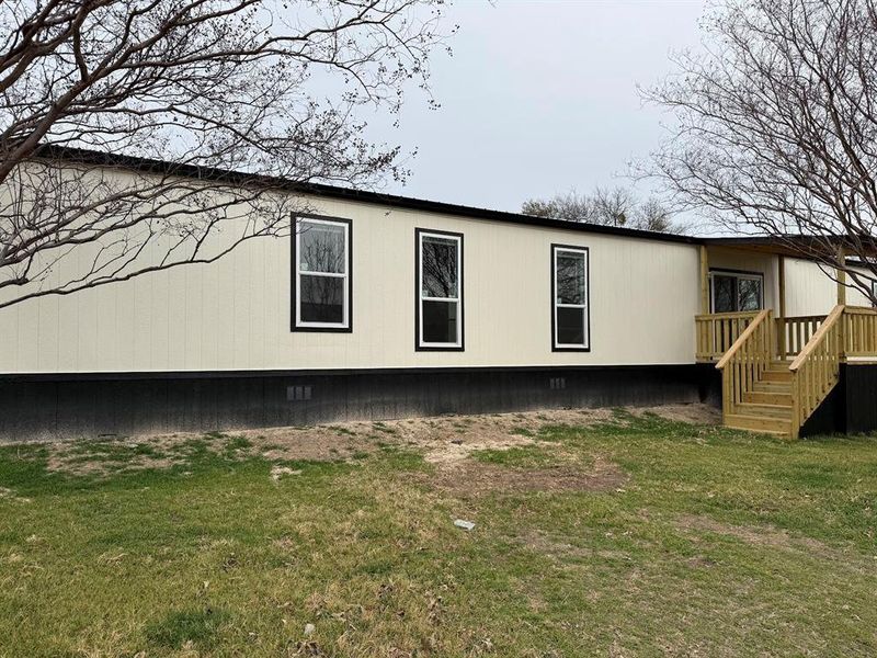 Exterior details and patio area of a home in , Pelican Bay (Image 17).