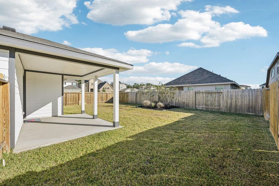Exterior details and patio area of a home in The Landing, New Caney (Image 21).