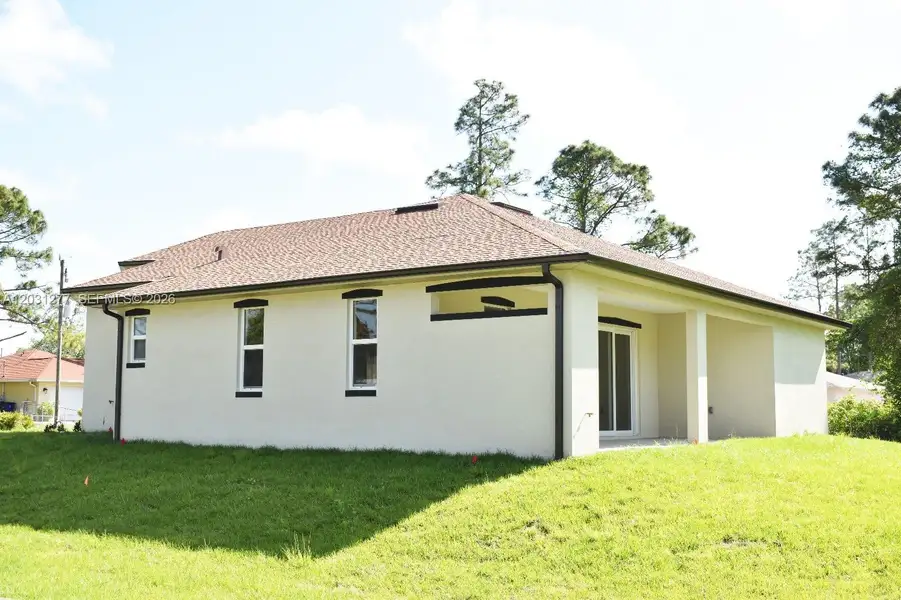 Exterior details and patio area of a home in , Lehigh Acres (Image 3).