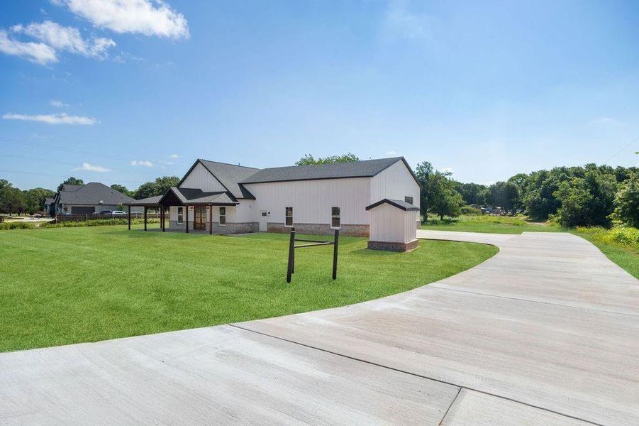 Front exterior of a new home in , Rhome, TX, highlighting curb appeal (Image 2). Front exterior of a new home in , Rhome, TX, highlighting curb appeal (Image 2).