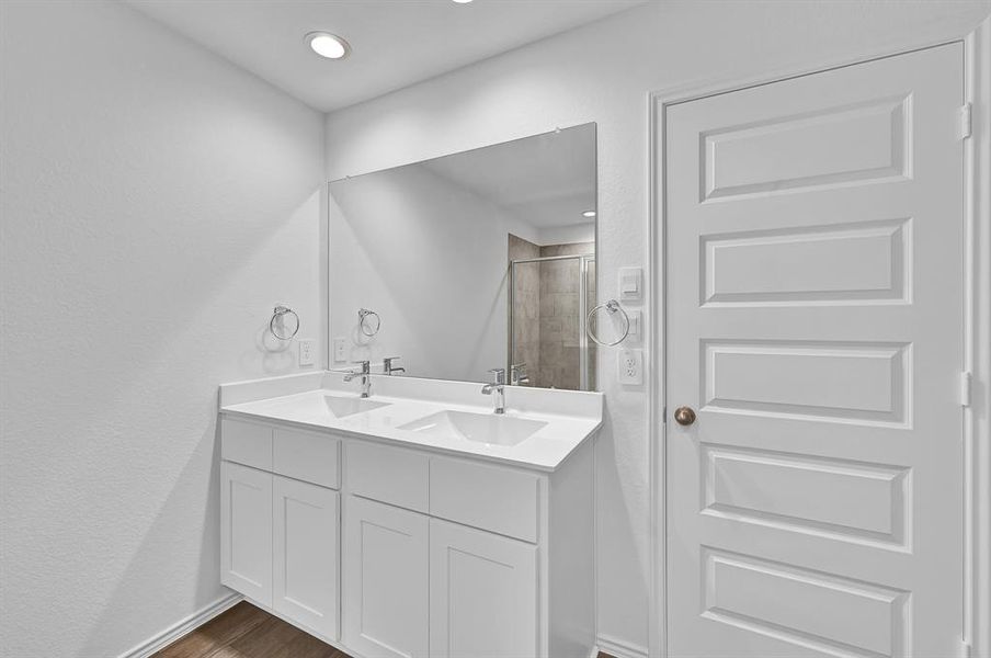 Gorgeous Shaker Cabinets, Quartz Vanity Countertop, His and Her Deep Undermount Sinks, Chic Bathroom Faucets and more! **Image Representative of Plan Only and May Vary as Built**