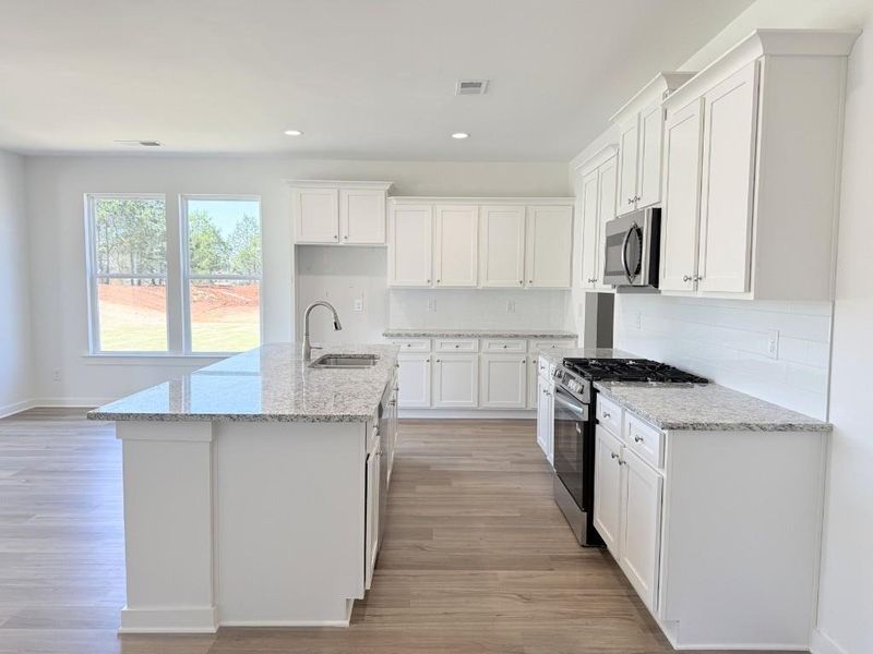 Furnished interior view inside a new home in Sutton's Landing, Statham (Image 9).