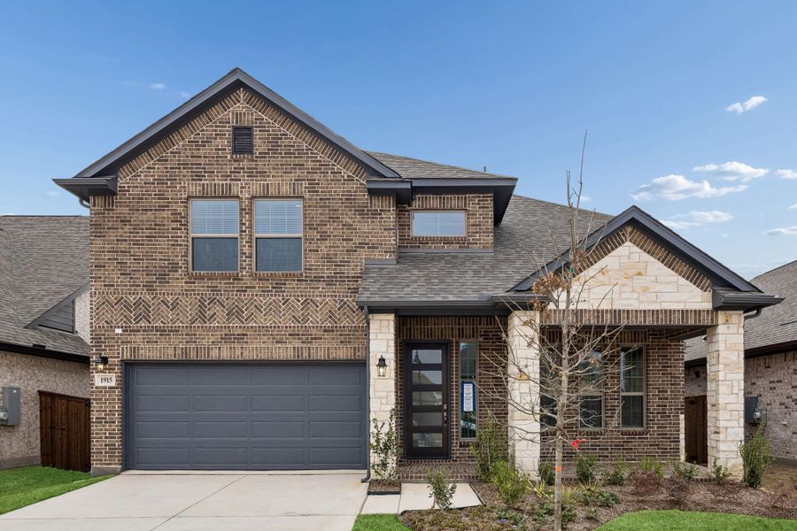 Front exterior of a new home in Las Lomas, Forney, TX, highlighting curb appeal (Image 24).