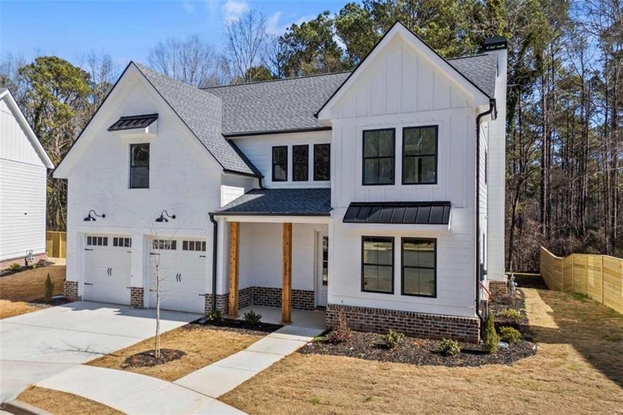 Front exterior of a new home in , Monroe, GA, highlighting curb appeal (Image 22).