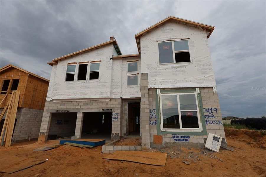 In-progress construction of a new home in Lake Star at Ovation, Winter Garden, FL (Image 5).