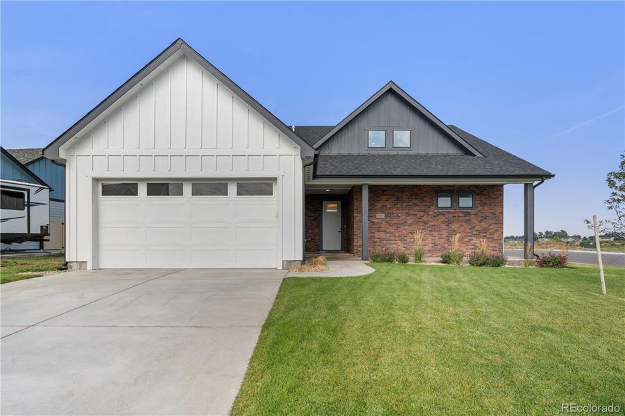 Front exterior of a new home in , Fort Morgan, CO, highlighting curb appeal (Image 25).