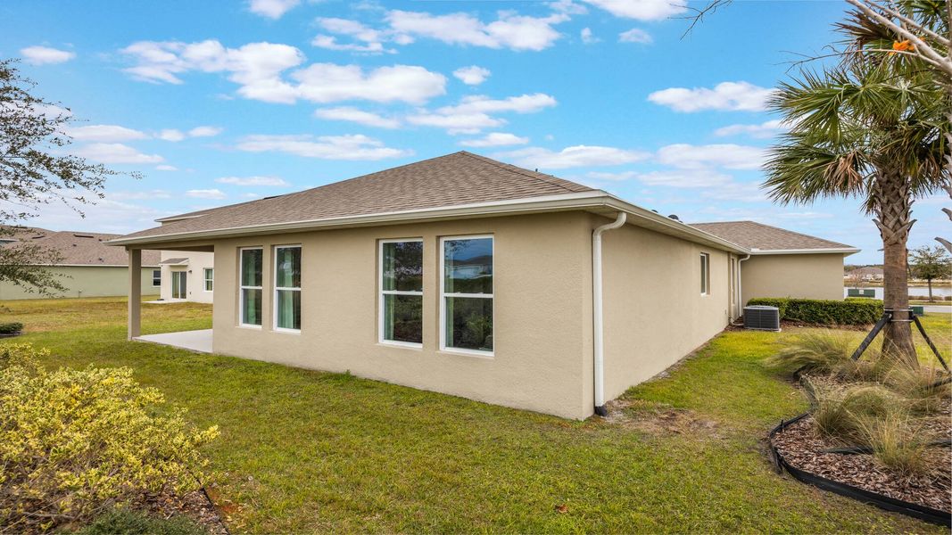 Front exterior of a new home in Archers Mill, Ormond Beach, FL, highlighting curb appeal (Image 18).