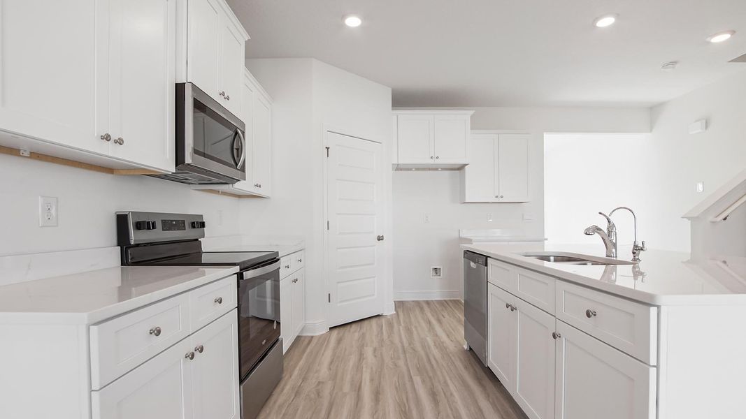 Furnished interior view inside a new home in Bayside at Ward Creek, Panama City Beach (Image 8).