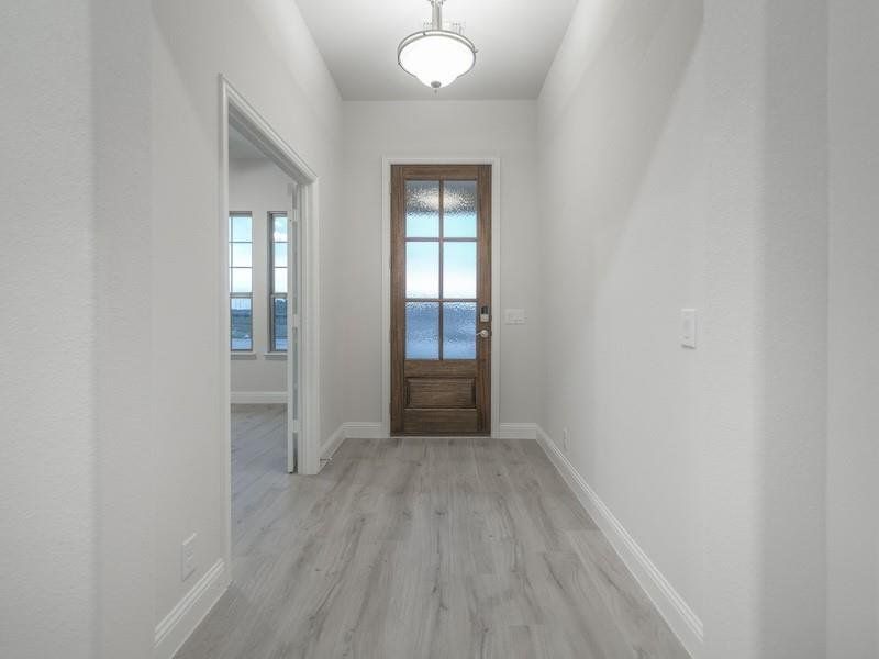 Doorway to outside featuring light hardwood / wood-style floors