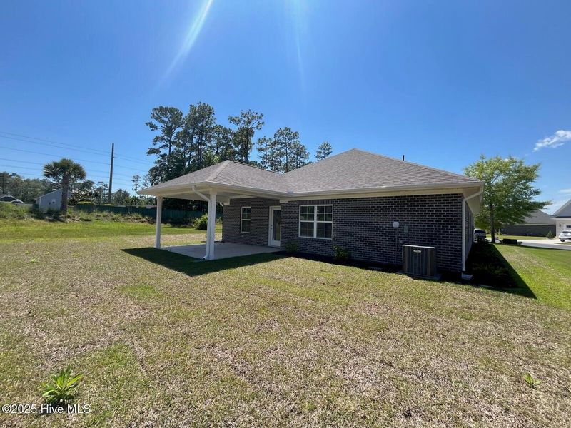 Front exterior of a new home in Palmetto Creek, Bolivia, NC, highlighting curb appeal (Image 14). Front exterior of a new home in Palmetto Creek, Bolivia, NC, highlighting curb appeal (Image 14).