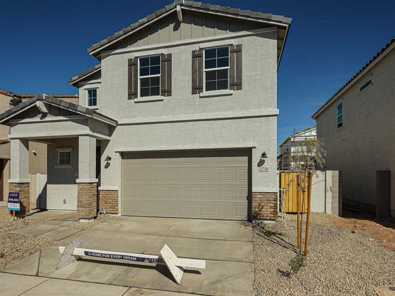 A house with a garage. A house with a garage.