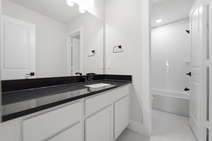 Furnished interior view inside a new home in The Woodlands at Medina Hills, Mico (Image 18).