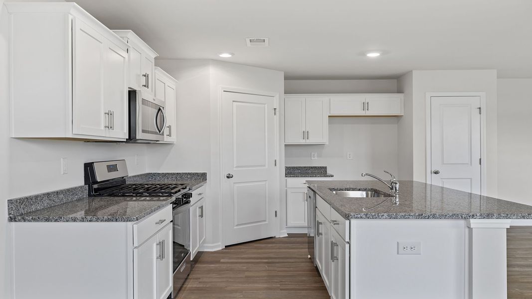 Furnished interior view inside a new home in Village Grove, Greenville (Image 6).