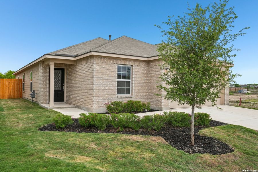 Front exterior of a new home in Preserve at Medina, Von Ormy, TX, highlighting curb appeal (Image 2). Front exterior of a new home in Preserve at Medina, Von Ormy, TX, highlighting curb appeal (Image 2).