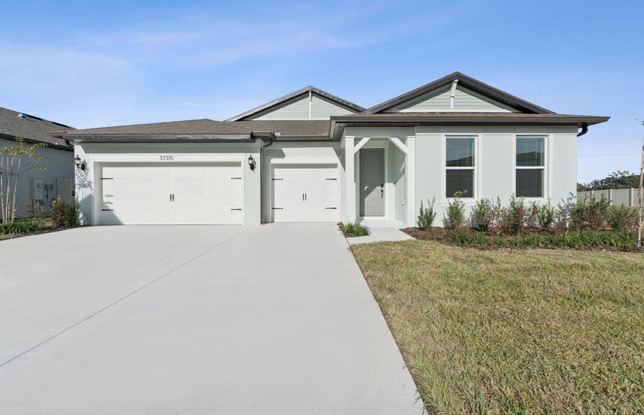 Representative exterior photo of a completed home built from the Merlot by Pulte Homes in Riverwood, Zephyrhills, FL (Image 22).