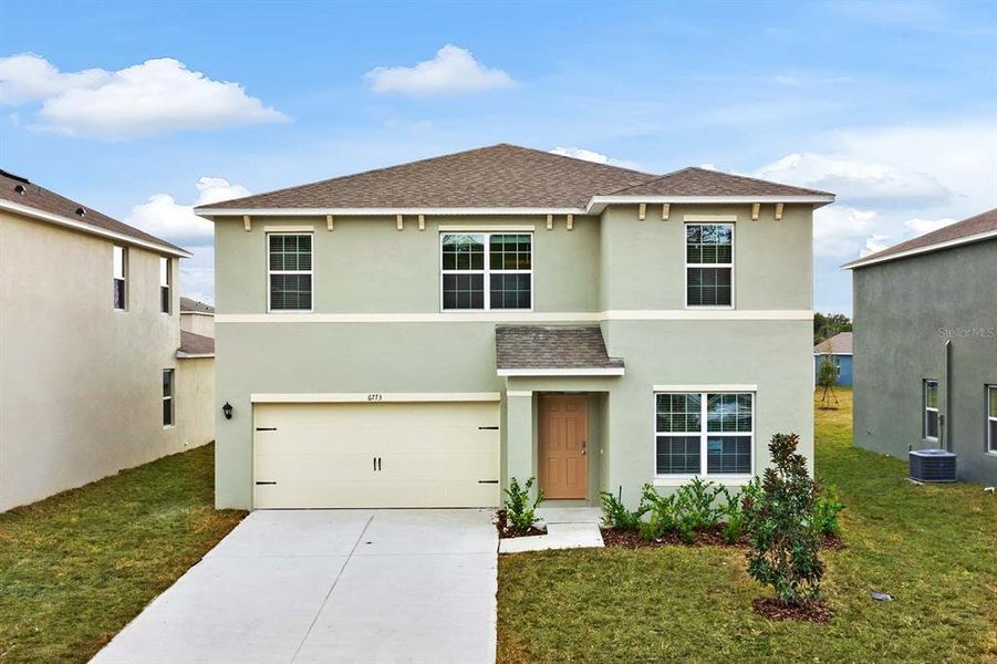 Front exterior of a new home in Windrose, Apopka, FL, highlighting curb appeal (Image 1). Front exterior of a new home in Windrose, Apopka, FL, highlighting curb appeal (Image 1).