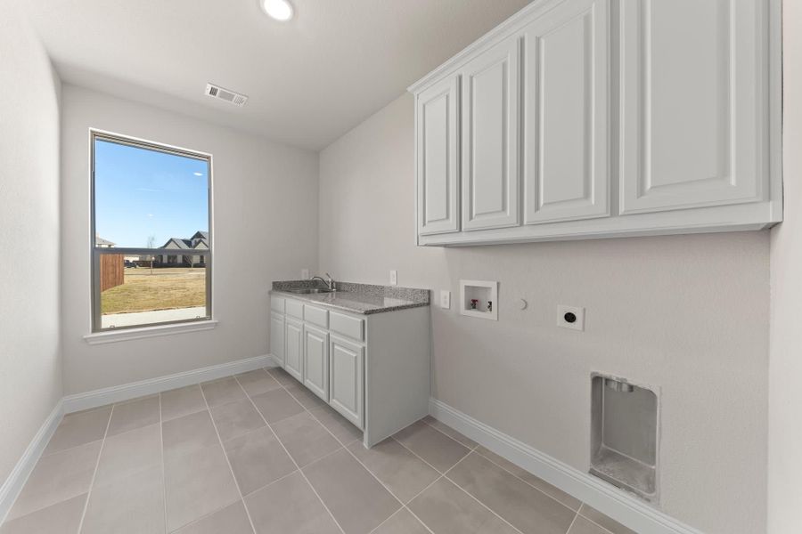 Laundry Room | Concept 3141 at Hidden Creek Estates in Van Alstyne, TX by Landsea Homes