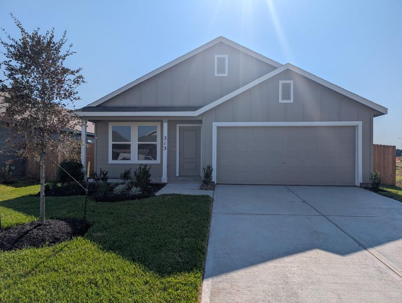 Front exterior of a new home in Pinewood Trails, Cleveland, TX, highlighting curb appeal (Image 1). Front exterior of a new home in Pinewood Trails, Cleveland, TX, highlighting curb appeal (Image 1).