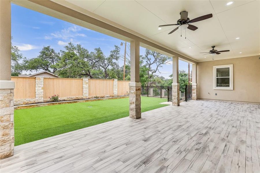 Gorgeous yard with artificial turf for low maintenance.