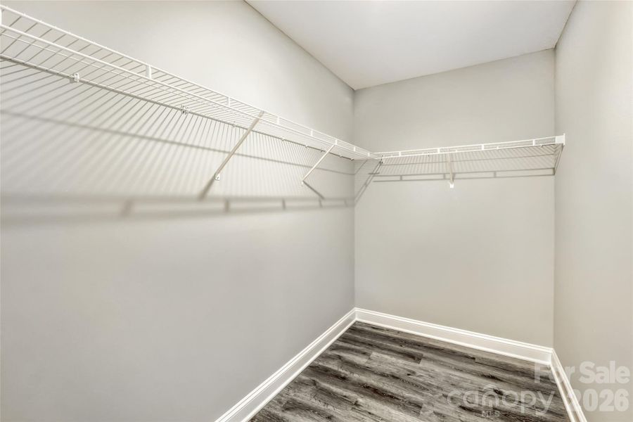 Spacious walk-in closet in the primary suite Spacious walk-in closet in the primary suite