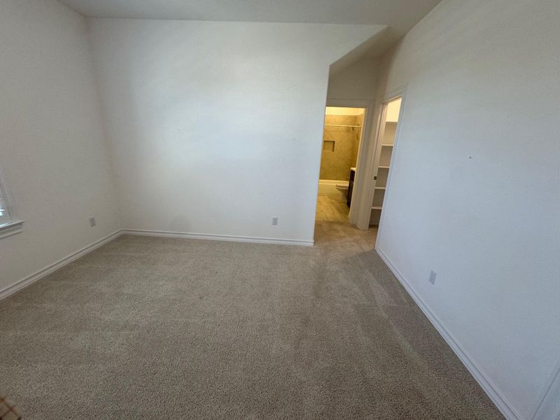 Bedroom 3 with in suite full bath and walk in closet.