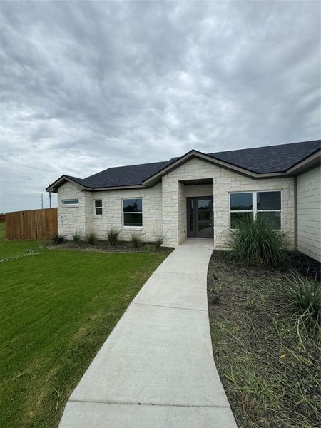 Front exterior of a new home in , Thorndale, TX, highlighting curb appeal (Image 21).