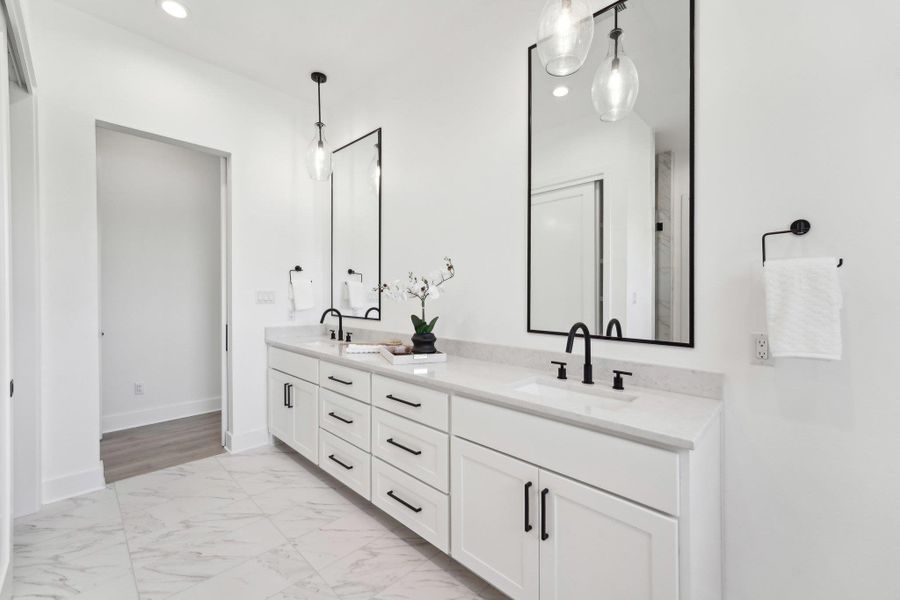 Elegant finishes and generous space define every bathroom in this home. Elegant finishes and generous space define every bathroom in this home.