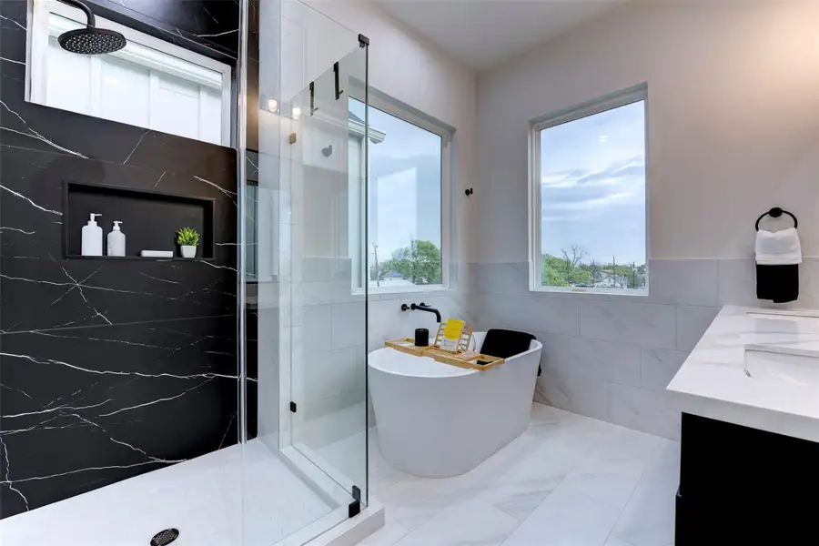 Extraordinary black tile accent in the primary shower Extraordinary black tile accent in the primary shower