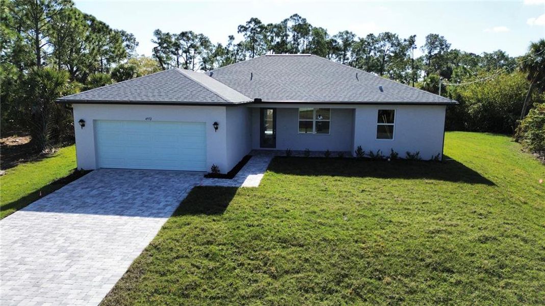 Front exterior of a new home in , North Port, FL, highlighting curb appeal (Image 19).
