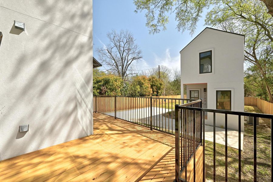 Wooden deck featuring fence