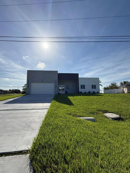 Front exterior of a new home in , Cape Coral, FL, highlighting curb appeal (Image 17).