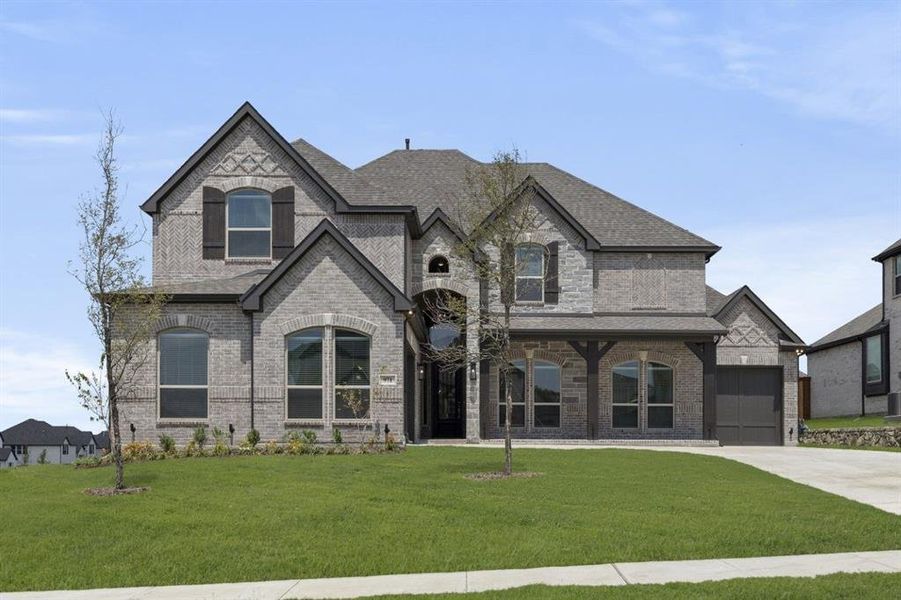 Front exterior of a new home in Cambridge Estates, Prosper, TX, highlighting curb appeal (Image 1).