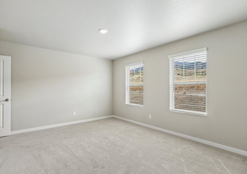 The master bedroom is spacious with a large windows. The master bedroom is spacious with a large windows.