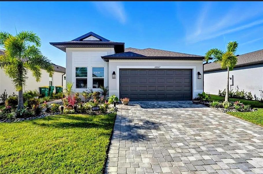Front exterior of a new home in , Port Charlotte, FL, highlighting curb appeal (Image 20). Front exterior of a new home in , Port Charlotte, FL, highlighting curb appeal (Image 20).