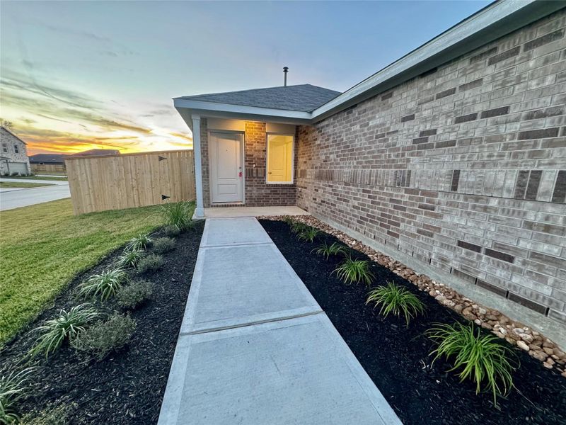 Exterior details and patio area of a home in Pinewood at Grand Texas, New Caney (Image 4).
