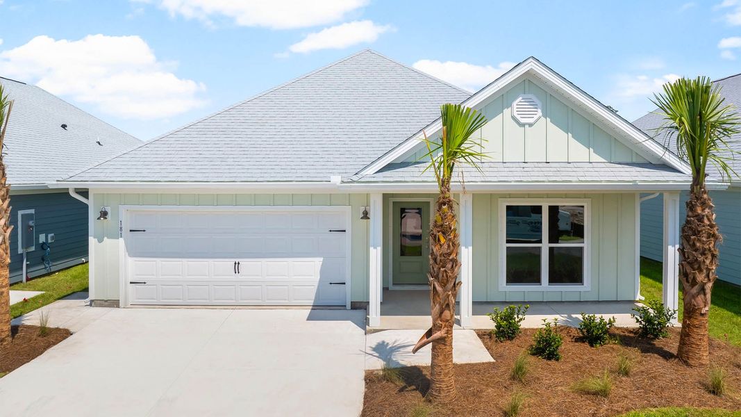 Front exterior of a new home in Windmark Beach, Port Saint Joe, FL, highlighting curb appeal (Image 1).