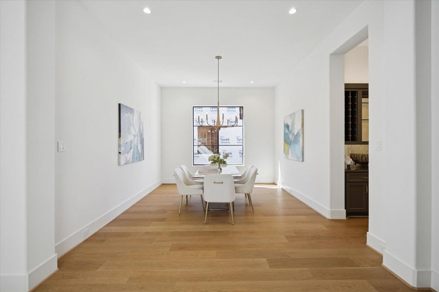 Formal Dining room with gorgeous RAM window - has access to entertaining bar and service area.