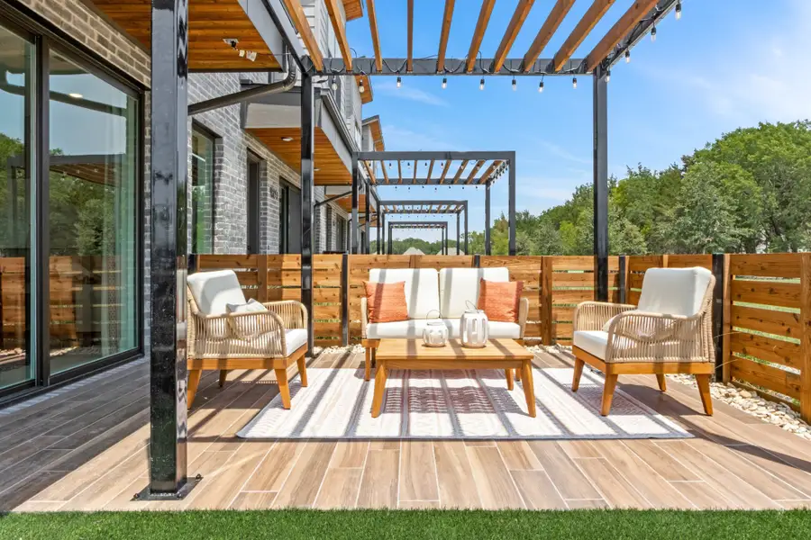 Exterior details and patio area of a home in Willow Grove Townhomes, Melissa (Image 3). Exterior details and patio area of a home in Willow Grove Townhomes, Melissa (Image 3).