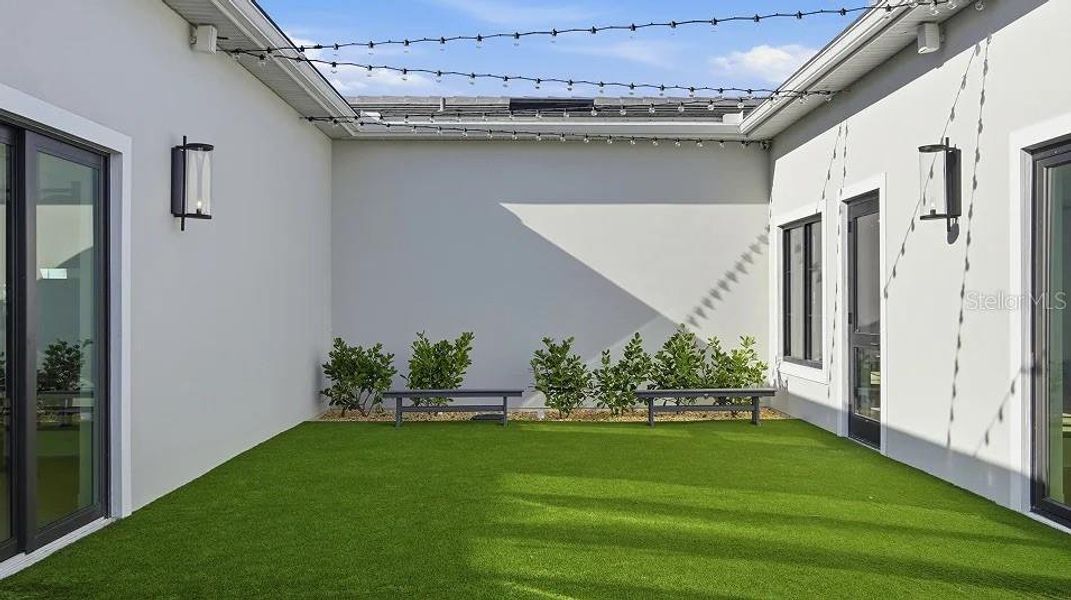 Exterior details and patio area of a home in Prosperity Lakes, Parrish (Image 35).